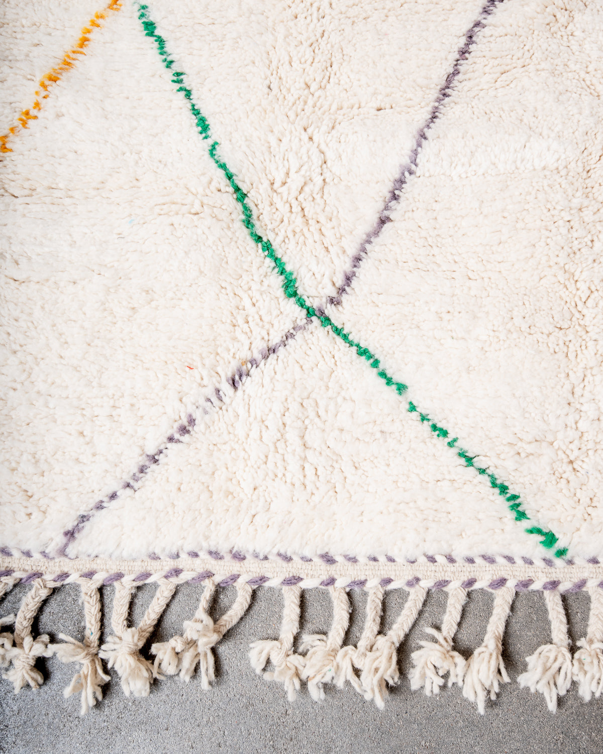 Modern, designer, handcrafted Berber rug from Morocco. Beniourain carpet with beautiful colours and patterns and fluffy wool texture.